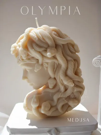 A sunlit shot of the Medusa candle, highlighting the incredible detail in her serpentine hair. This is a statement piece for anyone who loves mythology and art.