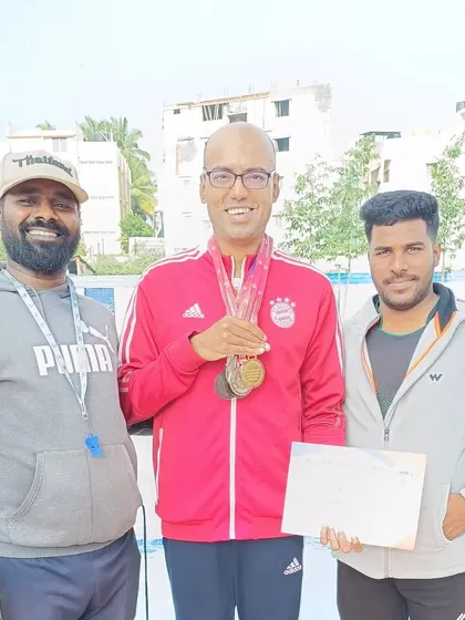 One of our dedicated coaches with a successful swimmer from the State Masters Championships. The partnership between coach and athlete is crucial for achieving competitive goals.