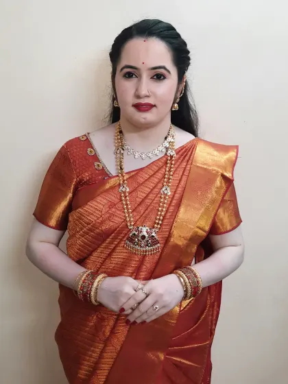 A full-length view of her birthday party look. The makeup and traditional styling create a timeless and elegant appearance.