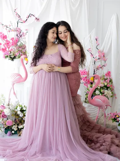 An elegant and emotional portrait of a mother and daughter. We offer a range of beautiful gowns to make your photoshoot experience feel extra special.