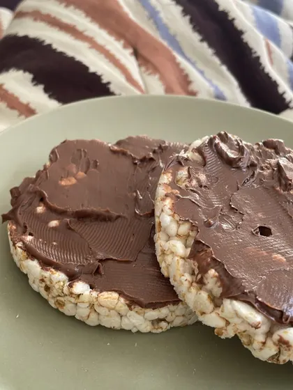 For when you need a quick snack to satisfy a sweet craving. These are simple rice cakes topped with a chocolate-hazelnut spread. It's a great example of portion control while still enjoying a treat.