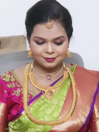 A downward glance showcasing the detailed eye makeup for Pallavi's baby shower. The blend of shimmer and matte shadows adds dimension and elegance.