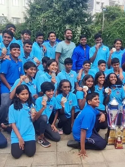 Our sub-junior water polo team, the future of our club, posing with their championship trophies. We nurture talent from a very young age to build a strong foundation for future success.