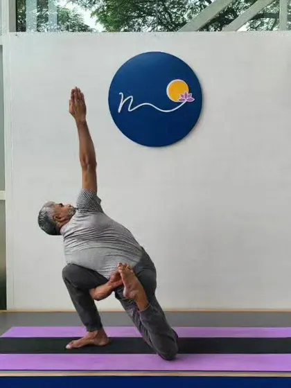 Baddha Parivritta Anjaneya Bekhasana is a complex pose combining a lunge, a twist, a bind, and a backbend. It challenges the entire body and requires a high level of coordination and flexibility.
