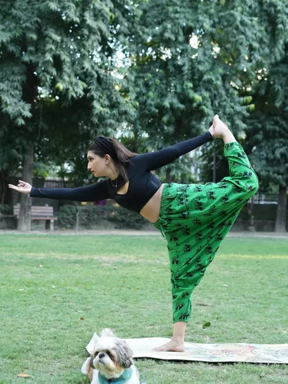 A side view of the Natarajasana pose, which deeply stretches the shoulders, chest, and thighs while improving balance and concentration.