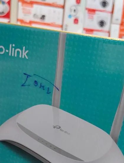 A TP-Link 300 Mbps wireless router, used for setting up network connectivity for IP cameras.
