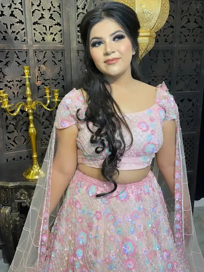 A front-facing view of this pretty pink engagement makeup. The look is soft, feminine, and glowing, perfect for a daytime or evening event.