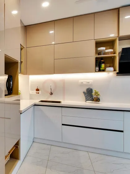 Under-cabinet lighting provides excellent task lighting while also highlighting the glossy finish of the cabinets.