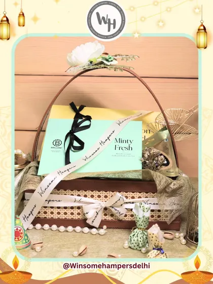A beautifully styled shot of my Diwali hamper collaboration with Brillare. This view highlights the elegant packaging, including a pearl string detail and decorative potlis, adding a touch of traditional luxury.