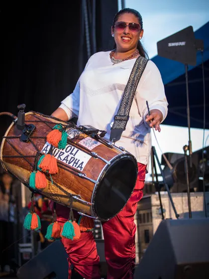 Dholi Anuradha bringing the fire to the stage at Basement Bhangra Bacchanal. Her powerful drumming is a core part of the authentic Bhangra experience we create.