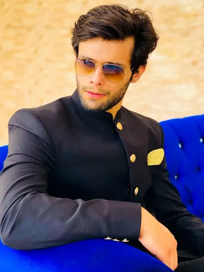 Adding sunglasses to the Jodhpuri suit gives it a cool, modern edge. Perfect for a daytime reception or pre-wedding shoot.