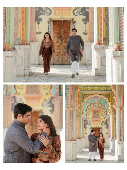 Ana and Ishan posing in front of the vibrant Patrika Gate. The intricate paintings on the arches provide a stunning and colorful background for their pre-wedding photos.