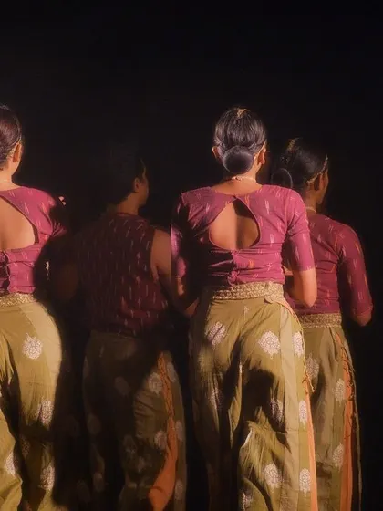 The back view of our dancers' costumes for 'Rasadrishta', showing the attention to detail in their attire and synchronized posture.
