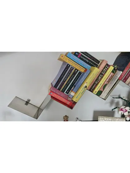 Another view of the sculptural bookshelf, showing how it plays with angles and gravity.