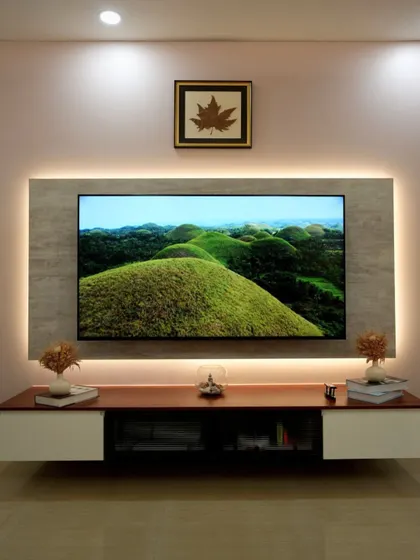 This TV unit beautifully merges modern design with deep personal meaning. The framed Kashmiri maple leaf, brought back from the client's homeland, serves as a treasured focal point and a constant connection to his roots.