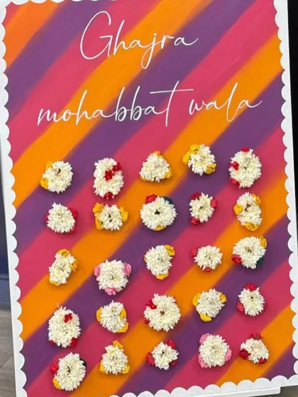 A beautiful "Ghajra mohabbat wala" board for a Sagan ceremony. Guests could pick a fresh gajra (floral bracelet) as a party favor, adding a lovely, fragrant, and traditional touch to the evening.