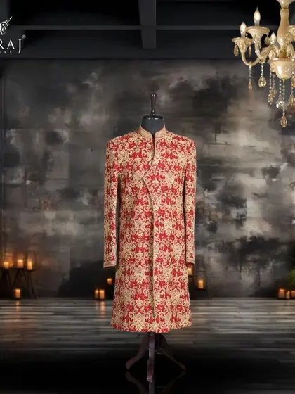 For the groom who embraces bold tradition, this red velvet sherwani is a perfect choice. The rich fabric is covered in Persian-inspired golden embroidery, creating a look of undeniable confidence and charm.