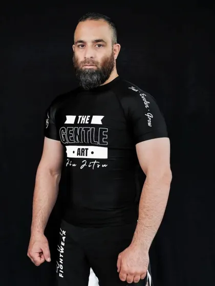 A portrait of our BJJ coach, Syed Rufaid Qadri. He embodies "The Gentle Art" with formidable skill.