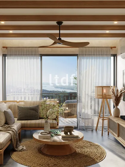 This living area is designed to bask in natural light, creating an open and inviting atmosphere. We selected minimal furniture to enhance the sense of space, while accents of greenery and natural materials like jute and wood add life and warmth to the home.