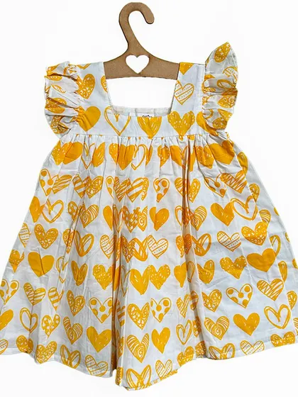 Yellow hearts are a symbol of hope and new beginnings. This cheerful heart-print dress with flutter sleeves is perfect for spreading a little sunshine wherever your little one goes.