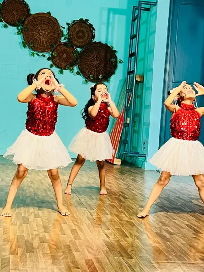 Behind the scenes of a recent shoot with our beginner batch, dressed in their sparkly costumes and full of expression.