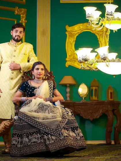 For an indoor, regal-themed pre-wedding shoot, I styled the couple in this elegant lehenga and a cream-coloured sherwani. The makeup is kept classic and sophisticated to match the grand setting.