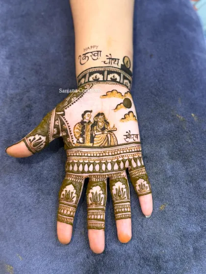 This is for my brides who want their love story told through mehndi. A custom Karwachauth portrait design, showing the wife seeing her husband through the sieve, is one of my favourite figures to create.