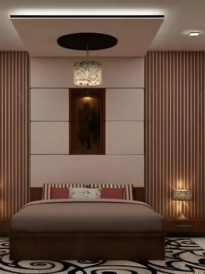 This bedroom design uses vertical fluted panels and a neutral color palette to create a sense of height and tranquility. The false ceiling with a statement pendant light adds a touch of elegance.