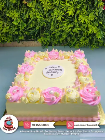 A simple and sweet square cake with pink and yellow piped roses for Anushka's birthday. A classic design that is always a beautiful choice.