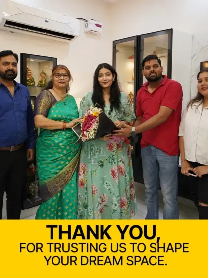 Thank you for trusting us to shape your dream space. This moment, presenting our client with flowers in her newly designed home, represents the successful end of a collaborative and creative journey.