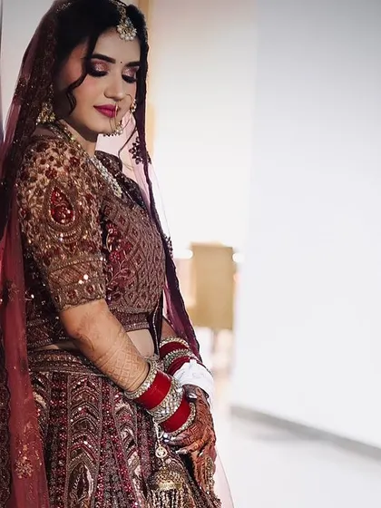 A full-length shot of the bride, looking serene and beautiful. Her makeup lasted perfectly throughout her wedding and reception.