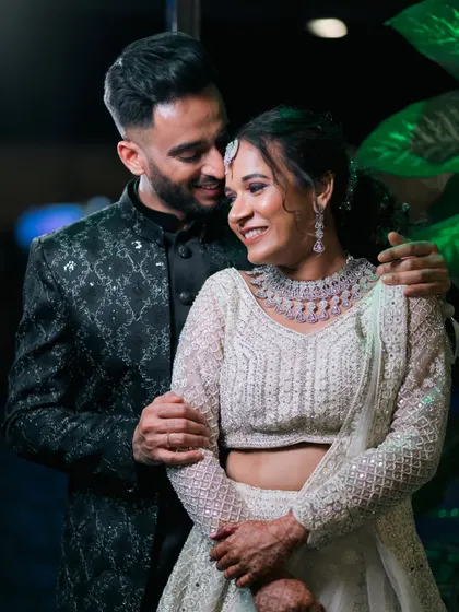 A sweet and intimate moment between the newlyweds at their reception. Their smiles say everything.