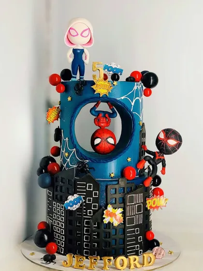 A Spider-Man cake with a twist! This design features multiple versions of the web slinger, including Ghost-Spider, in a dynamic, multi-layered scene. It's a modern and exciting take on a classic theme.