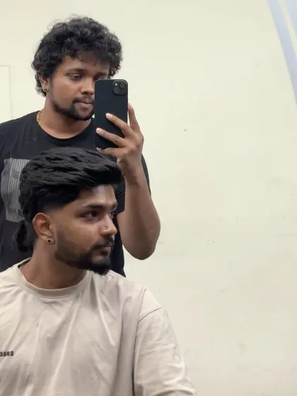 A mirror selfie with the client, showing the front view of the low-fade mullet.