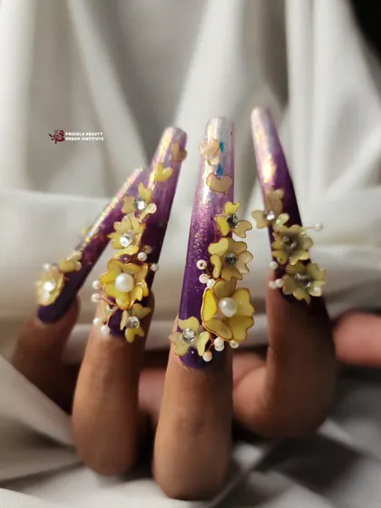 This angle captures the length and drama of the purple floral nails, showing how the 3D elements are placed along the extra-long extensions.