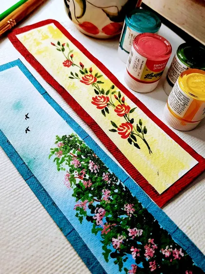 Two hand-painted bookmarks created with acrylics on leftover watercolor paper. These make for beautiful, personalized gifts for book lovers and are a great way to practice miniature painting techniques.