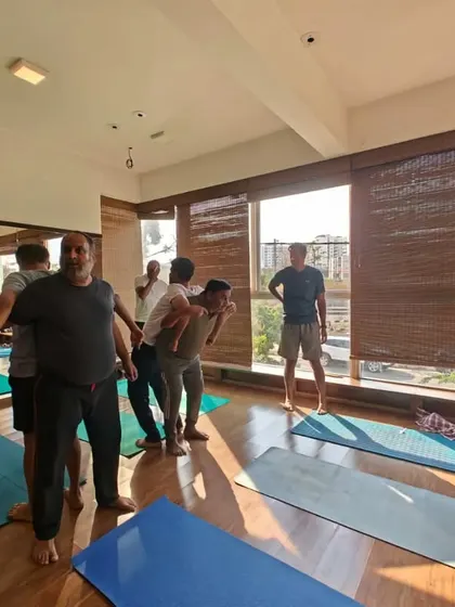 The studio is filled with energy and focus during our partner yoga sessions. It's a wonderful opportunity for students to connect and learn in a different way.