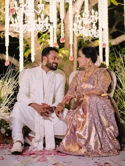 The bride and groom sharing a sweet, knowing look during their wedding ceremony.