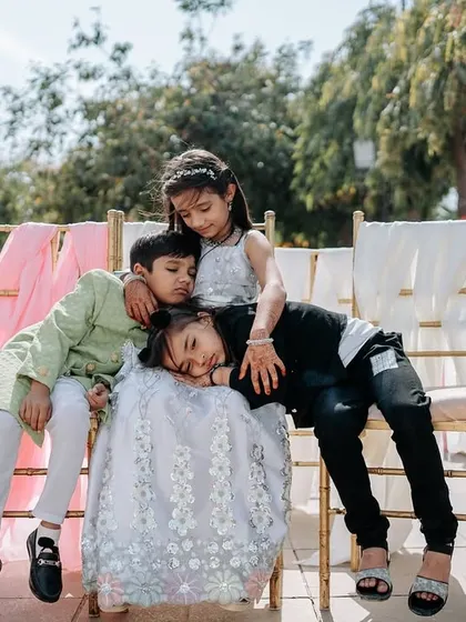 After a long day of celebrations, the kids find a moment to rest together. This is a sweet, unposed photograph that captures the reality of a wedding day.