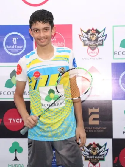 Pravit Sahu, a multiple title winner, holding his racket at the Thakur Village Championship. He won men's singles, under-15 singles, and doubles titles.