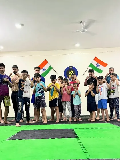 A serious moment before a fun training session. Our mixed class of kids and adults gets ready to learn, embodying our philosophy that anyone can train and grow with us.