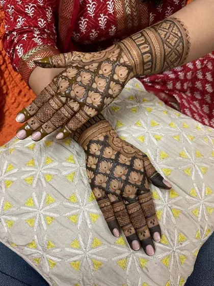 This design showcases a full hand of repeating lotus patterns, a symbol of purity and beauty. It's a testament to how intricate, pattern-based work can be just as stunning as a portrait.