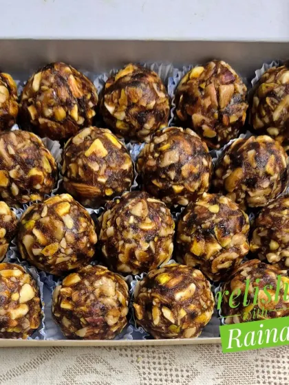 A close-up of the Dryfruit Laddoos, showing the rich texture from the chopped nuts and dates.