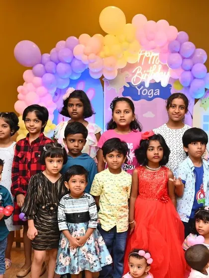 A group of happy kids posing at a Peppa Pig themed party. Our goal is to create a fun and joyful atmosphere for the children and their friends.