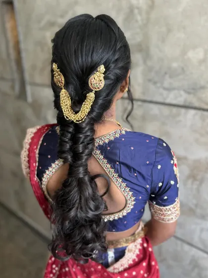 This shot captures the movement in the curly ends of the braid, adding a playful and modern touch.