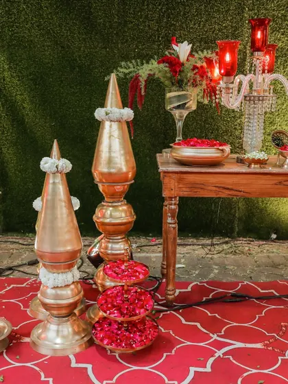 Traditional brass decor elements and trays of fresh rose petals, ready for the rituals. I ensure that even the smallest details are beautifully presented.