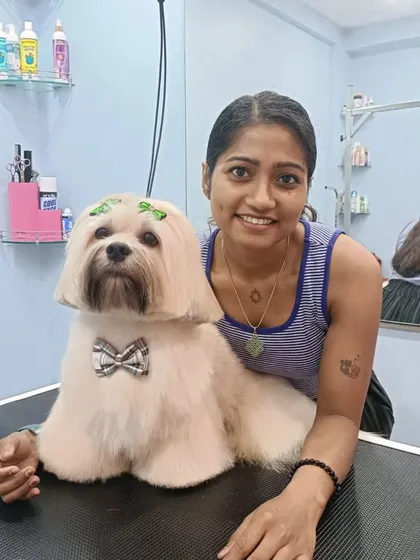 Me with Mojo the Lhasa Apso. I love building a bond with each dog I groom.