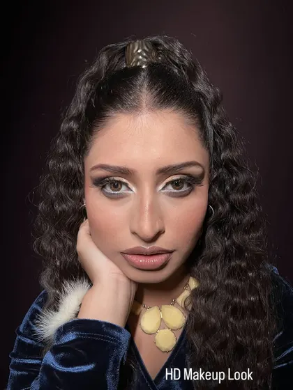 A direct, full-face view of the HD makeup, showing the clean application and the intensity of the eye look.