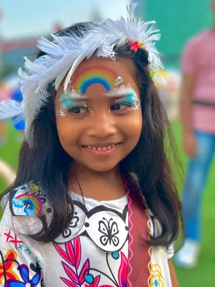 A bright, happy smile framed by a colorful rainbow and fluffy clouds. This cheerful design is perfect for kids of all ages and adds a splash of color to any party.
