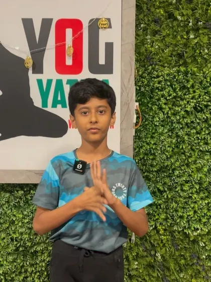 This young student is ready to share his thoughts on yoga with us.